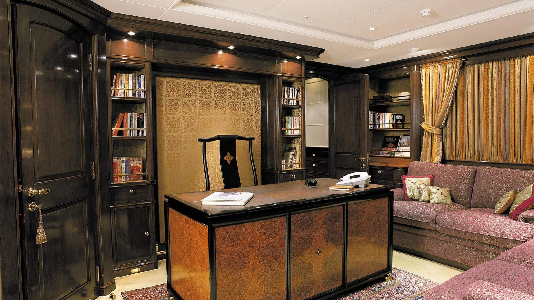 a room with a desk and a couch aboard ROCK & ROLL Yacht for Sale