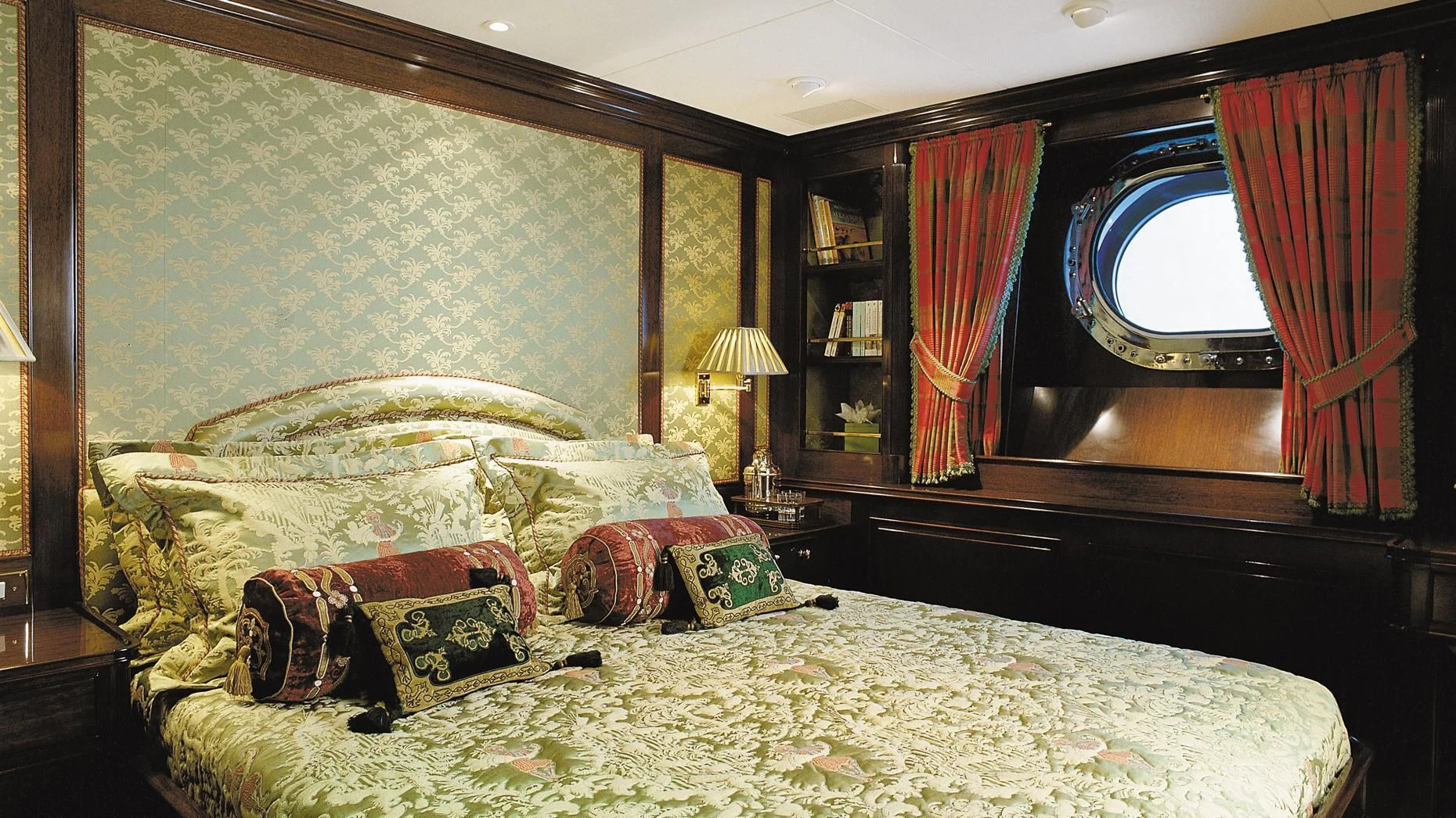 a bedroom with a bed and a mirror aboard ROCK & ROLL Yacht for Sale
