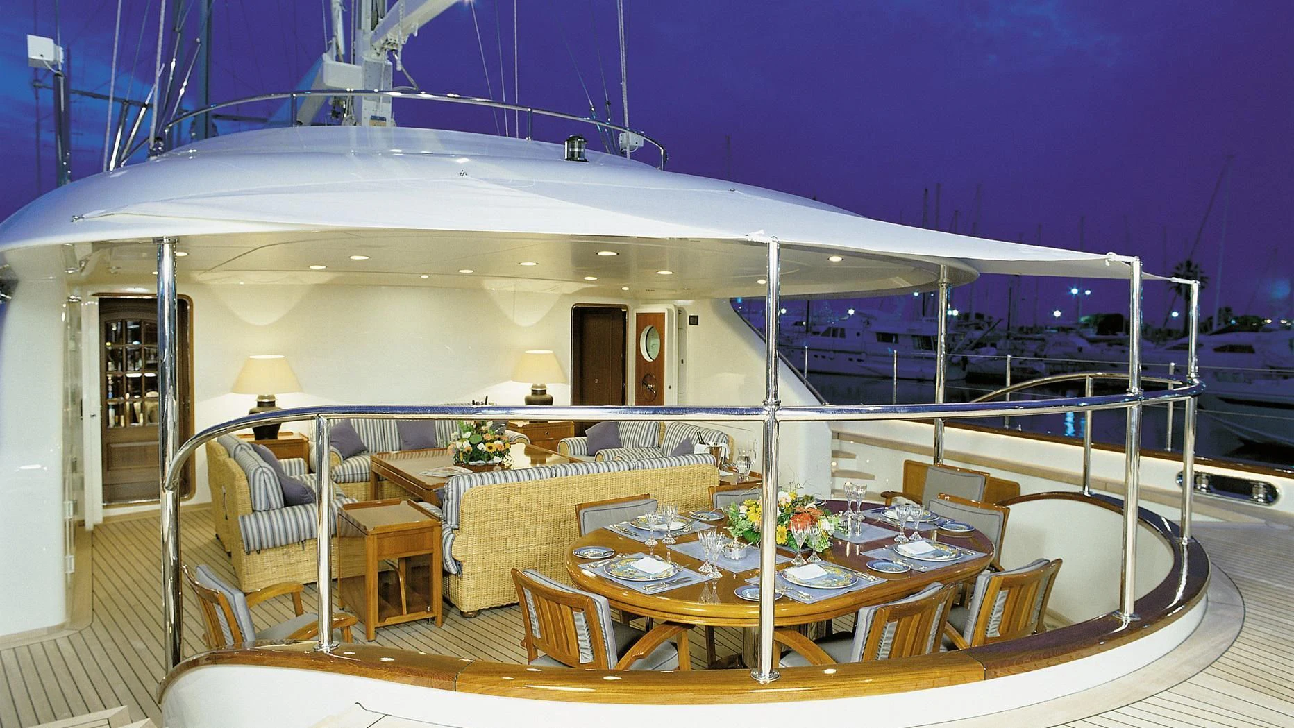 a large patio with a table and chairs aboard ROCK & ROLL Yacht for Sale