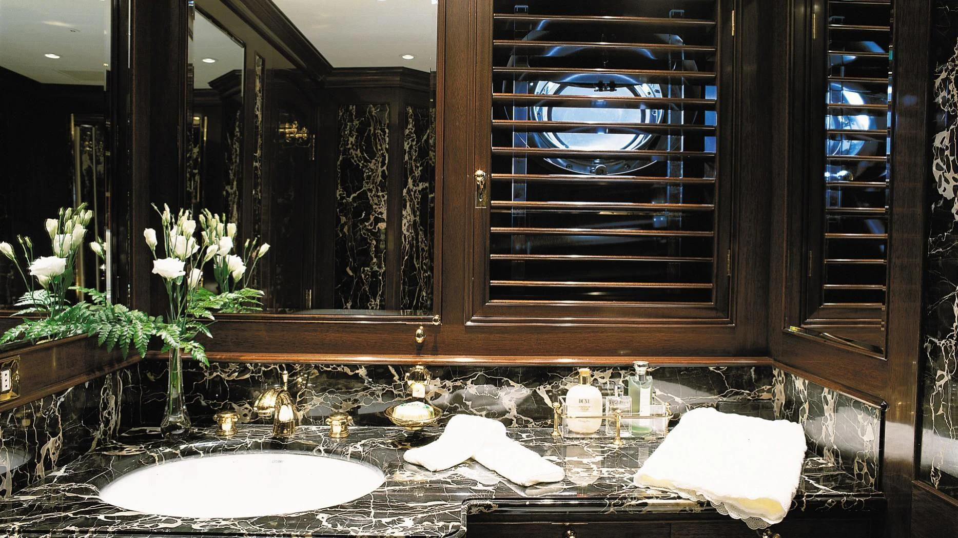 a bathroom with a large mirror aboard ROCK & ROLL Yacht for Sale