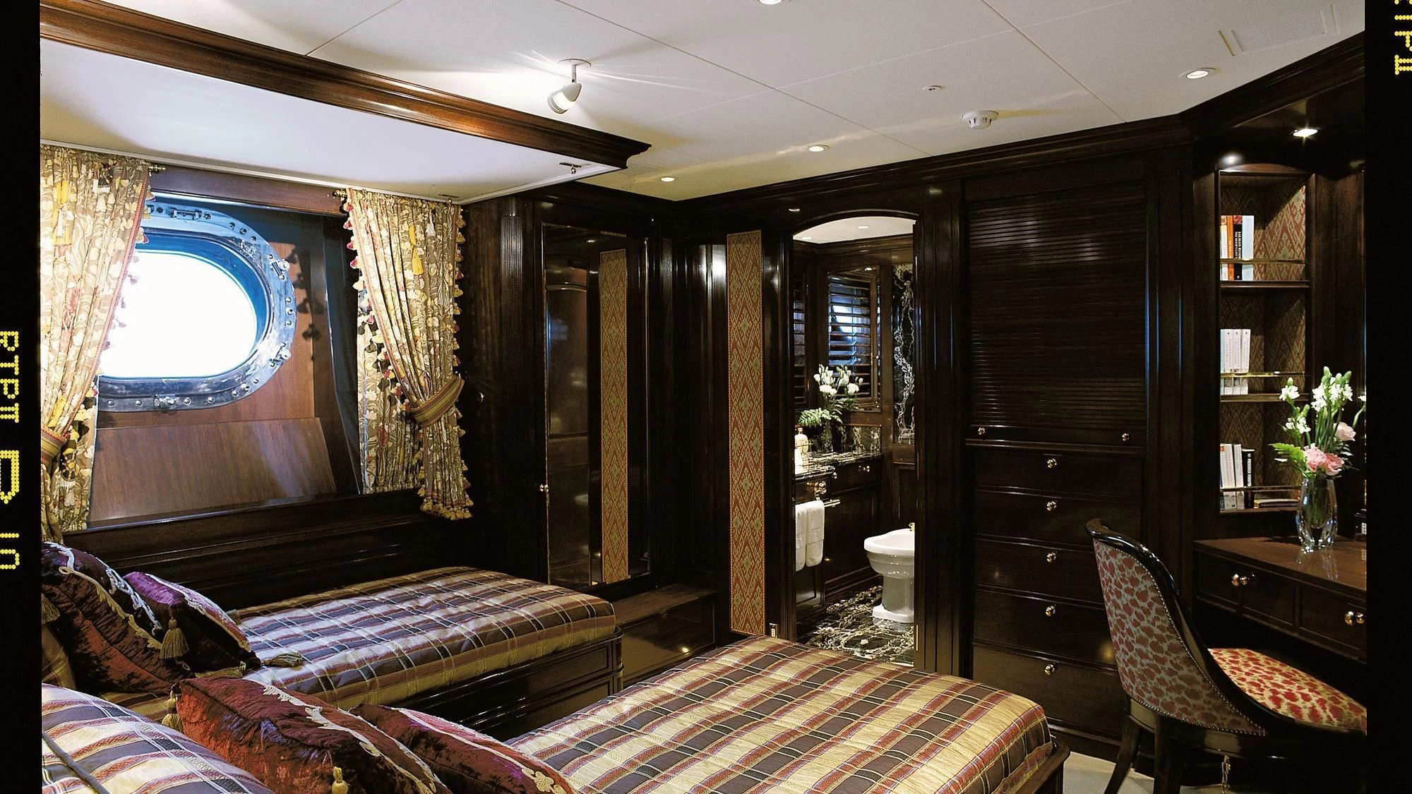 a room with a bed and a desk aboard ROCK & ROLL Yacht for Sale