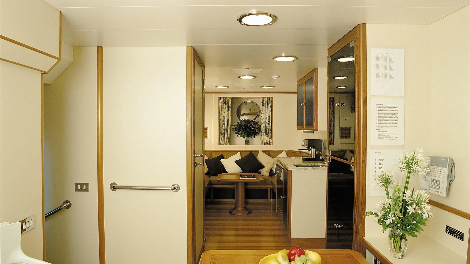 a room with a table and chairs aboard ROCK & ROLL Yacht for Sale