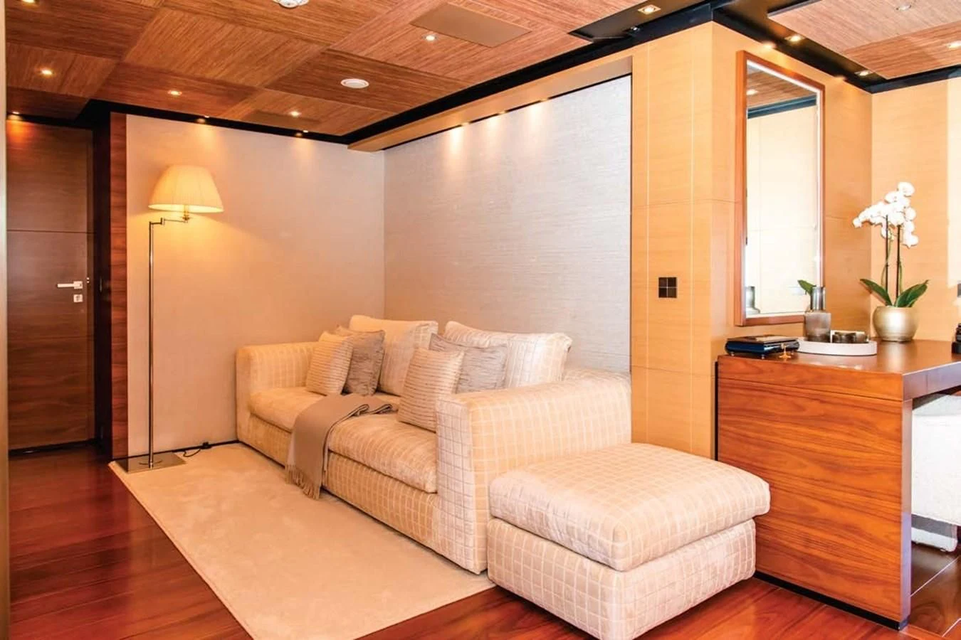 a living room with a couch and a lamp aboard ALI BABA Yacht for Sale