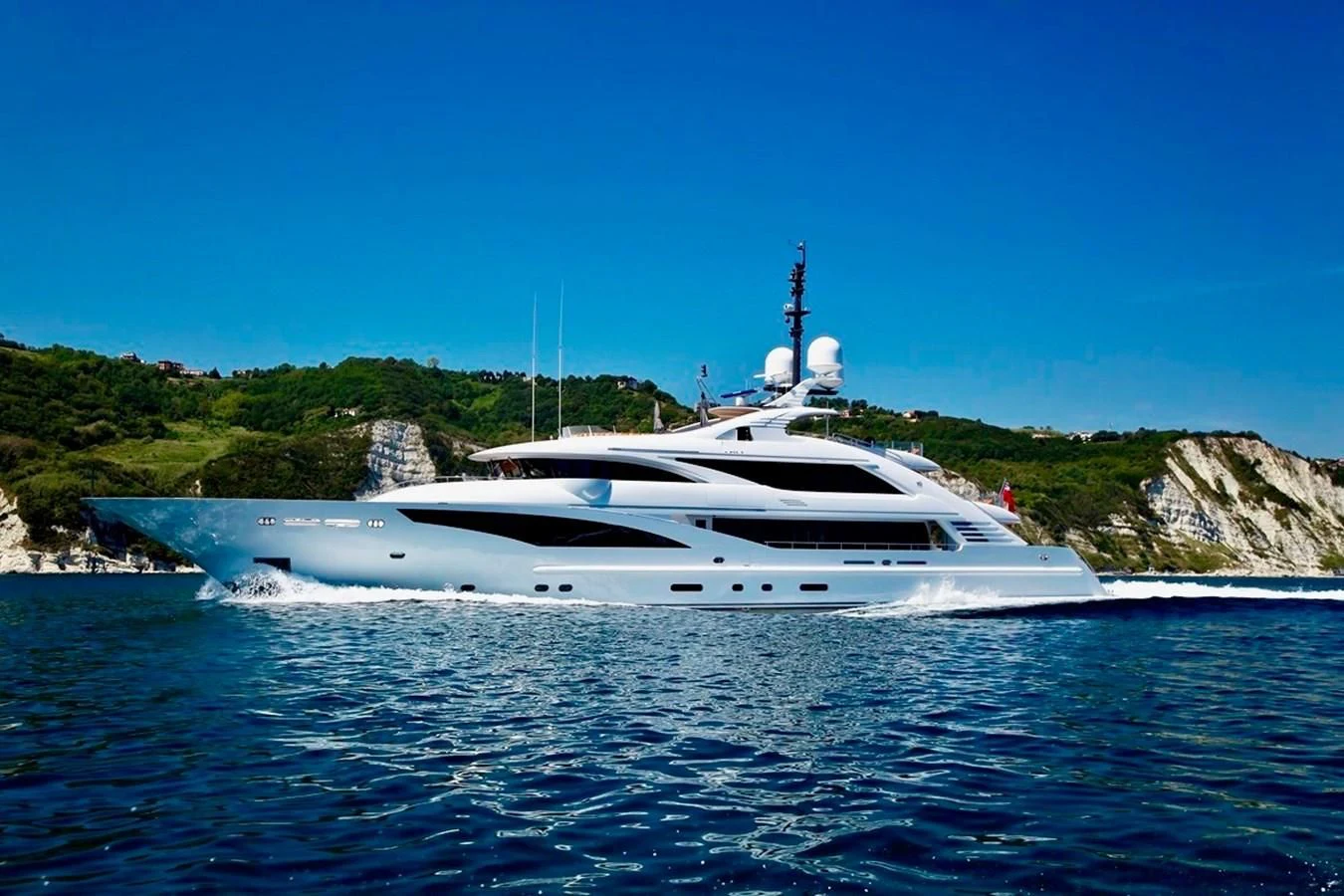 a white yacht on the water aboard ALI BABA Yacht for Sale