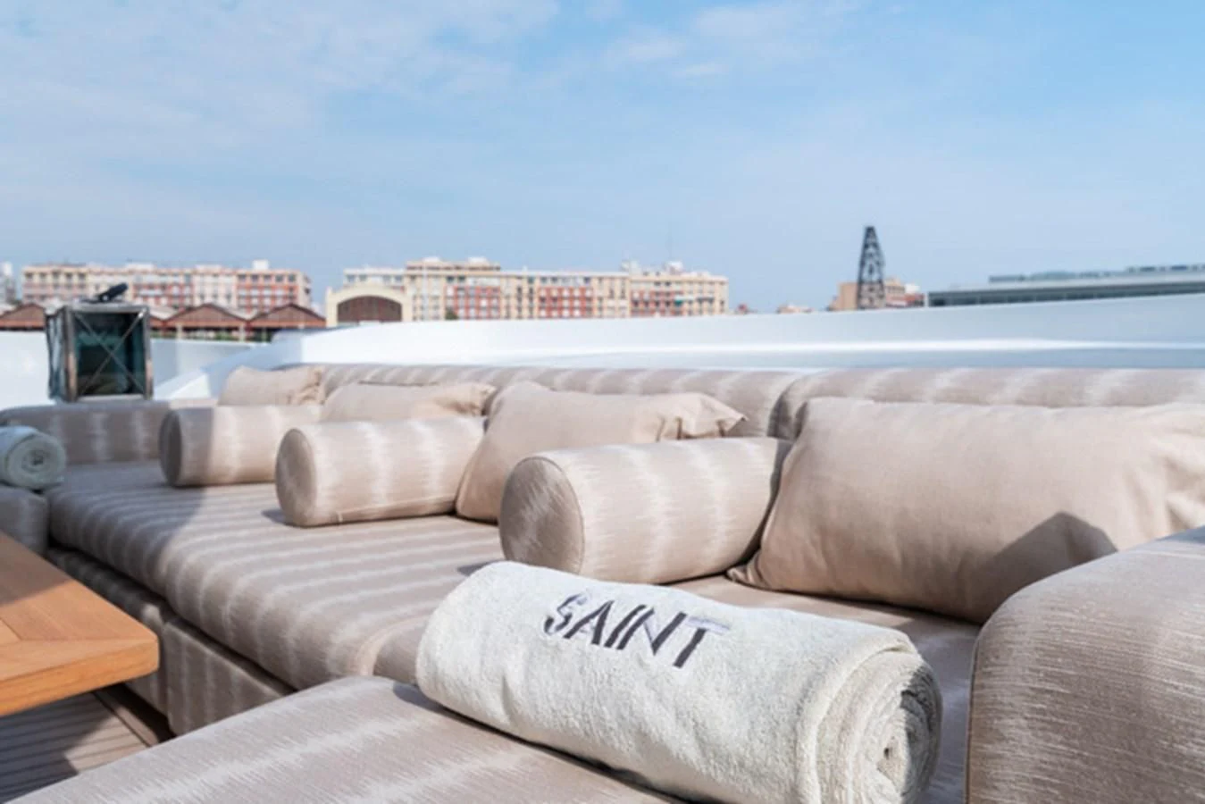 a couch with pillows on it aboard ALI BABA Yacht for Sale