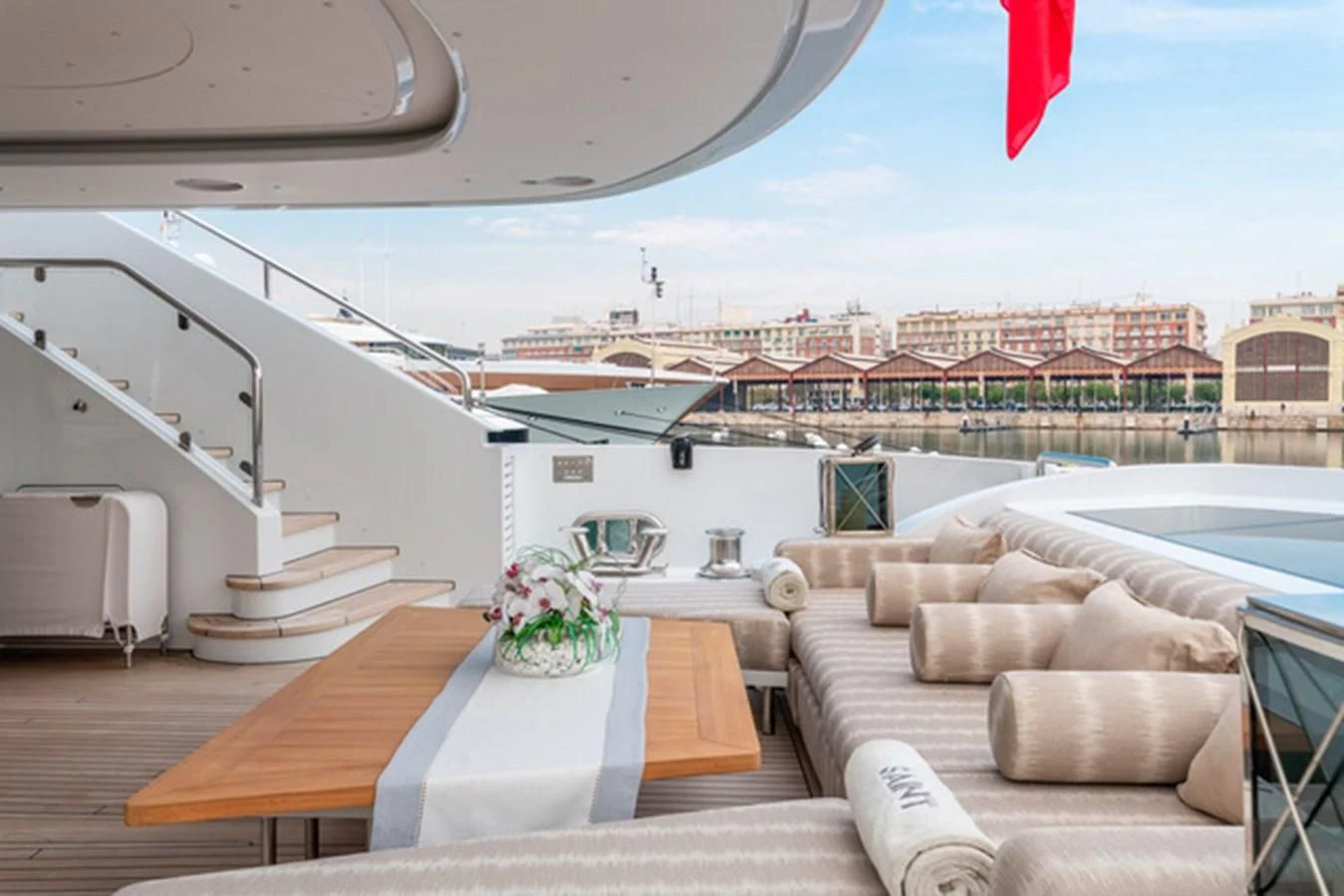 a room with a couch and a table and chairs aboard ALI BABA Yacht for Sale
