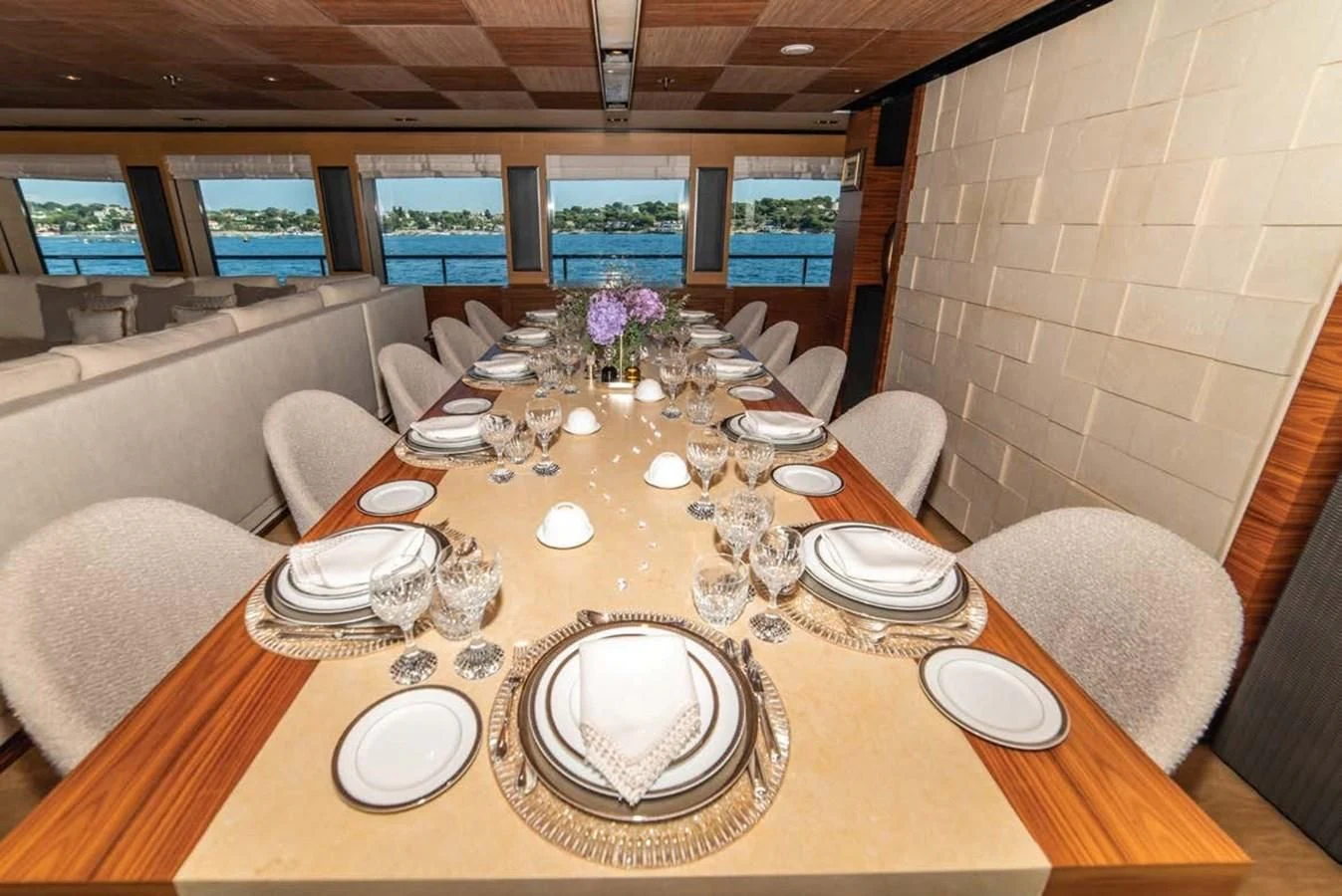 a table set with plates and silverware aboard ALI BABA Yacht for Sale