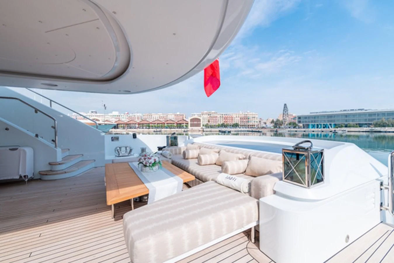 a room with a view of a city and a large body of water aboard ALI BABA Yacht for Sale