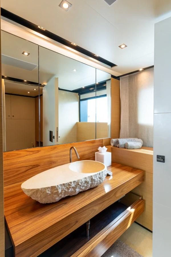 a bathroom with a sink and a large mirror aboard ALI BABA Yacht for Sale