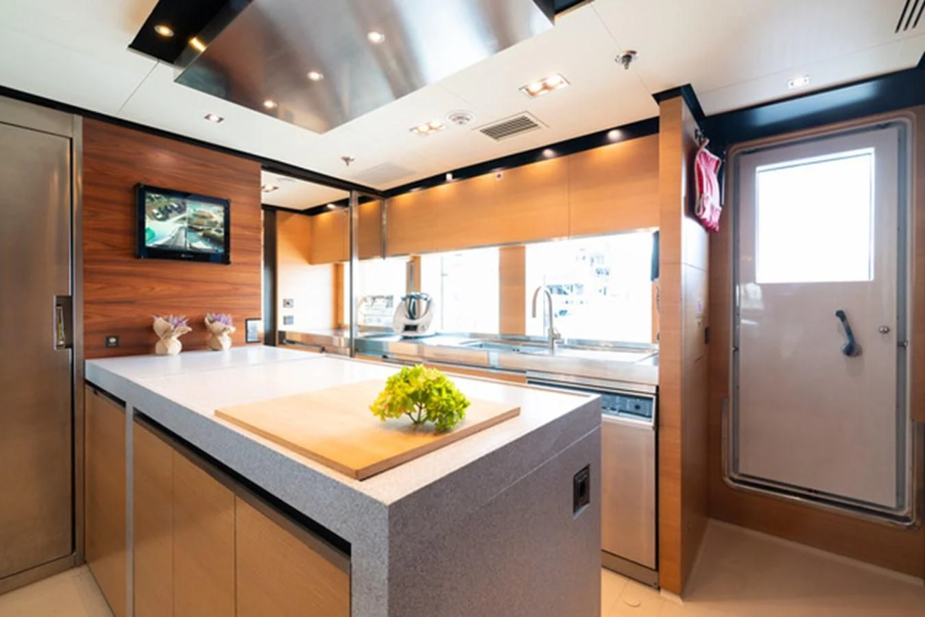 a kitchen with a large island aboard ALI BABA Yacht for Sale