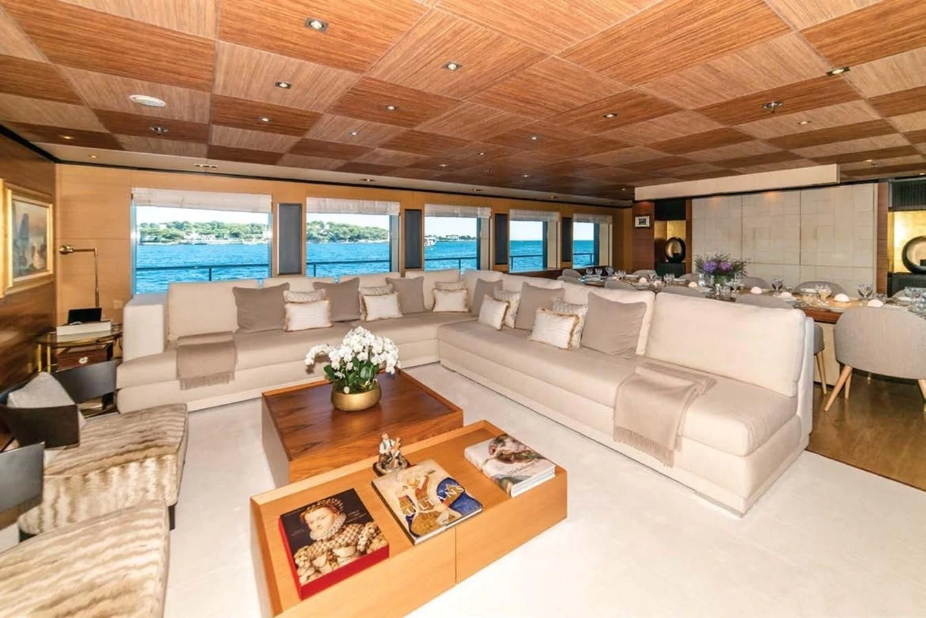 a living room with a large screen aboard ALI BABA Yacht for Sale