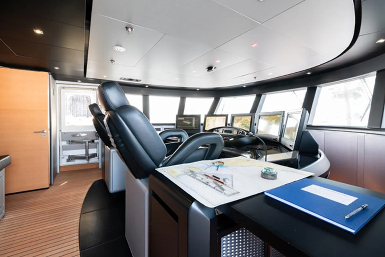 a room with computers and chairs aboard ALI BABA Yacht for Sale