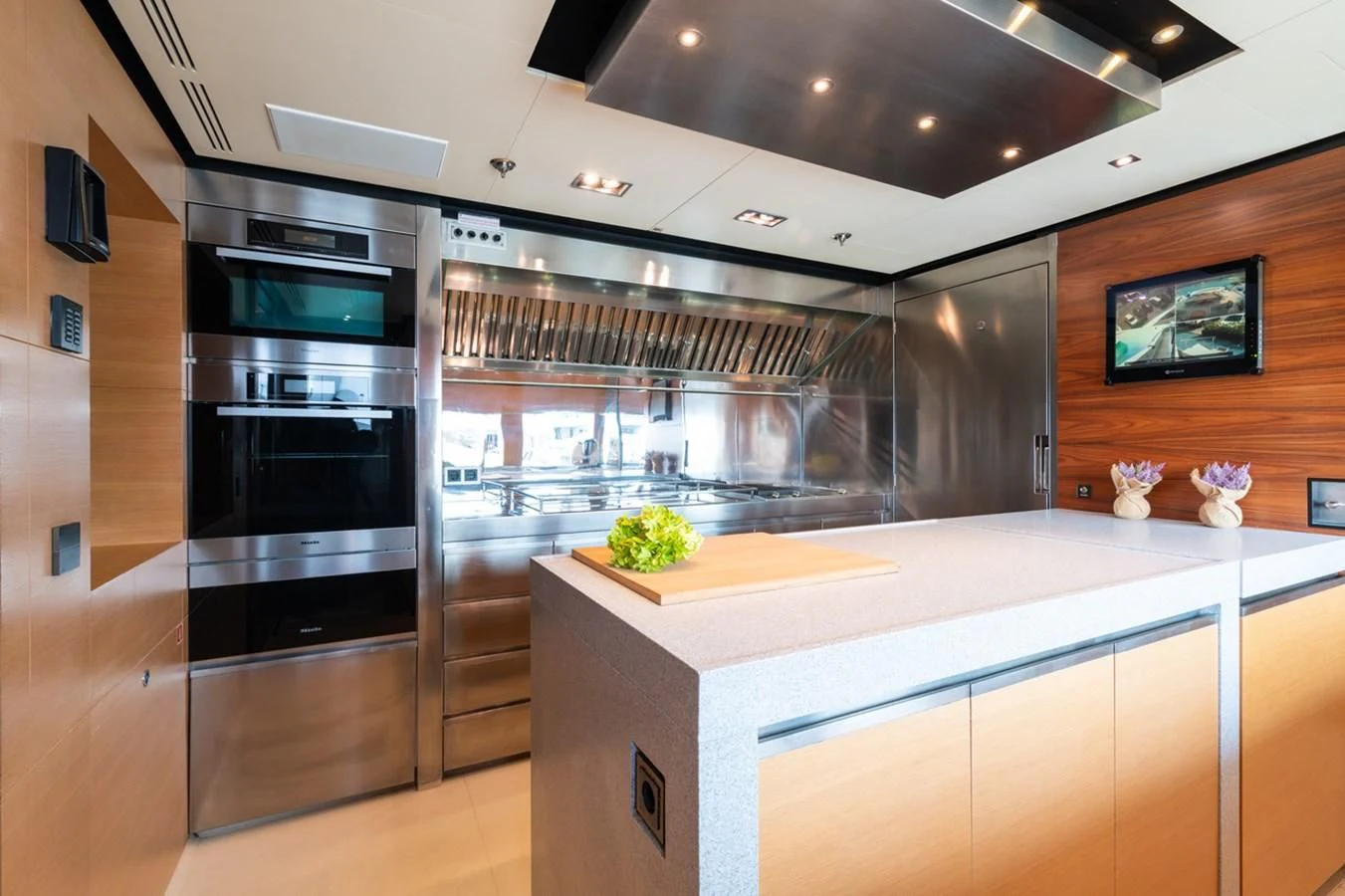 a kitchen with a large island aboard ALI BABA Yacht for Sale
