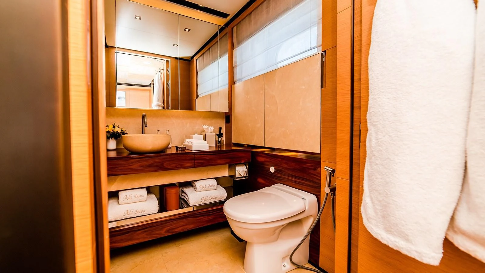 a bathroom with a toilet and a sink aboard ALI BABA Yacht for Sale