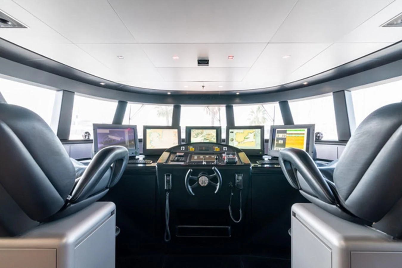 inside of a vehicle with monitors and seats aboard ALI BABA Yacht for Sale