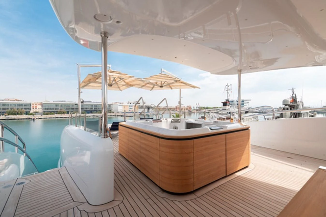 a table and chairs on a deck aboard ALI BABA Yacht for Sale
