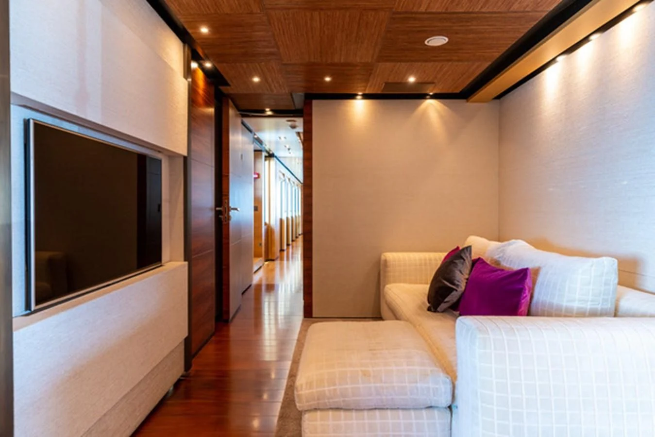a room with a couch and a mirror aboard ALI BABA Yacht for Sale
