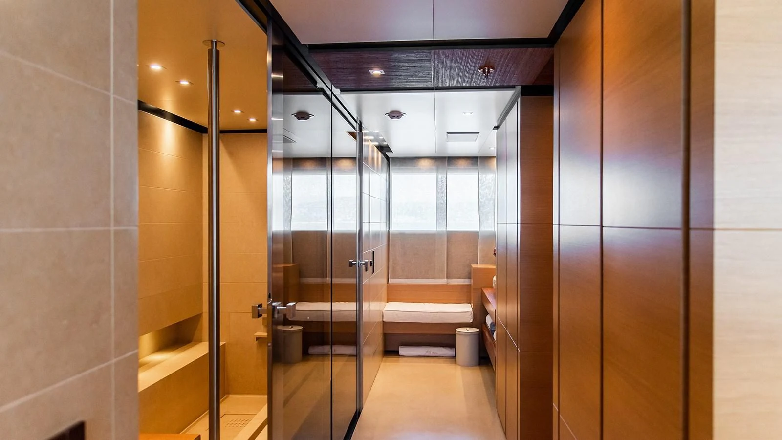 a bathroom with a glass shower aboard ALI BABA Yacht for Sale