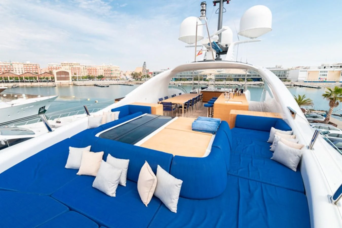 a pool with a deck and chairs aboard ALI BABA Yacht for Sale