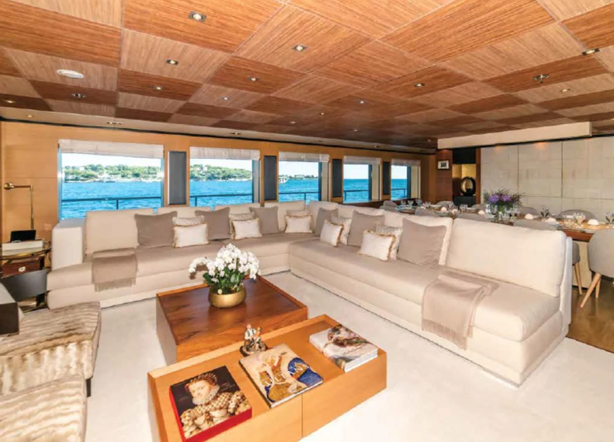 a living room with a large screen aboard ALI BABA Yacht for Sale