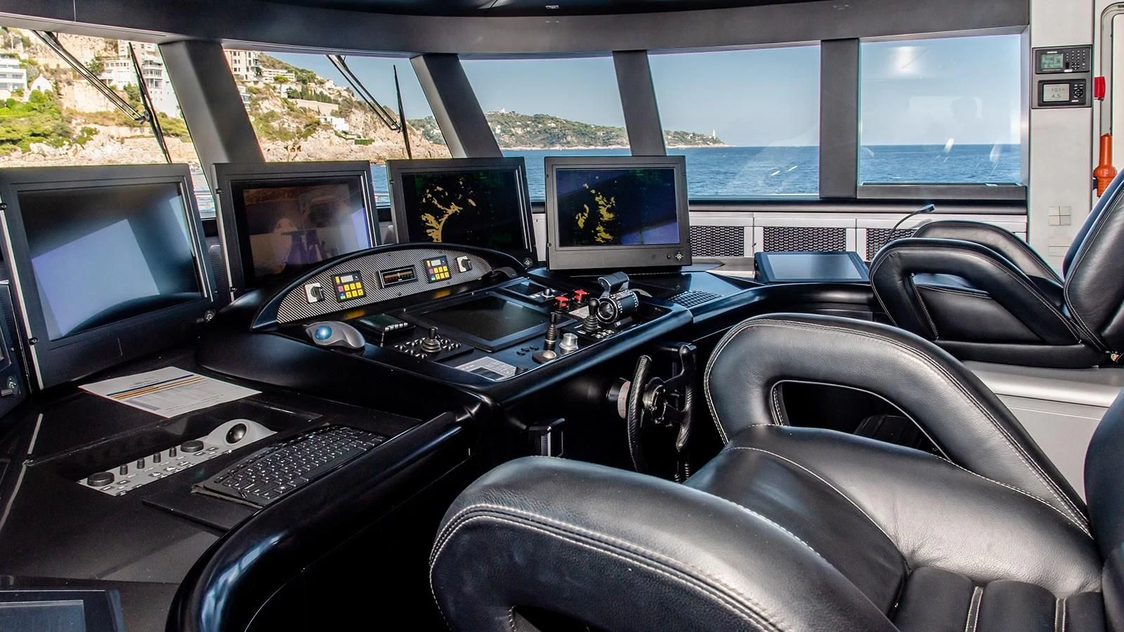 a car with many monitors and keyboards aboard ALI BABA Yacht for Sale