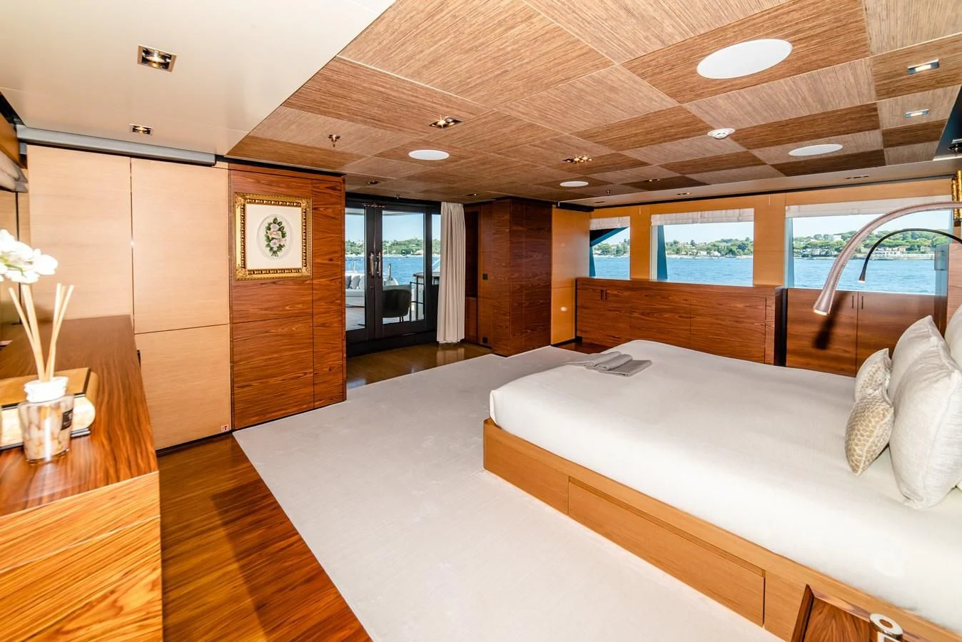 a room with a bed and a table aboard ALI BABA Yacht for Sale