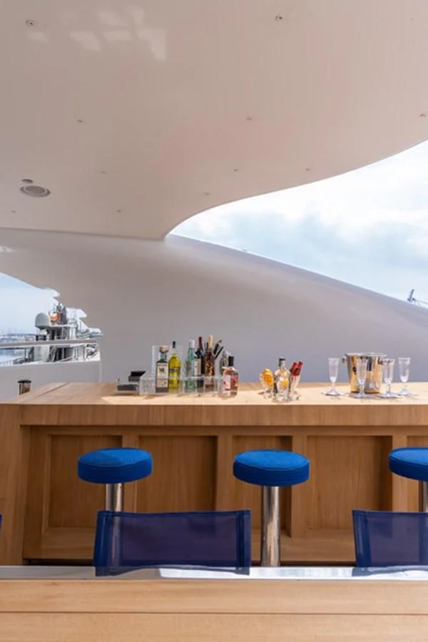 a bar with a table and chairs aboard ALI BABA Yacht for Sale