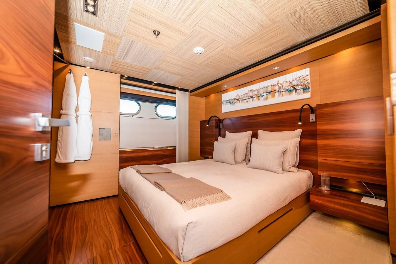 a room with a bed and a wood wall aboard ALI BABA Yacht for Sale