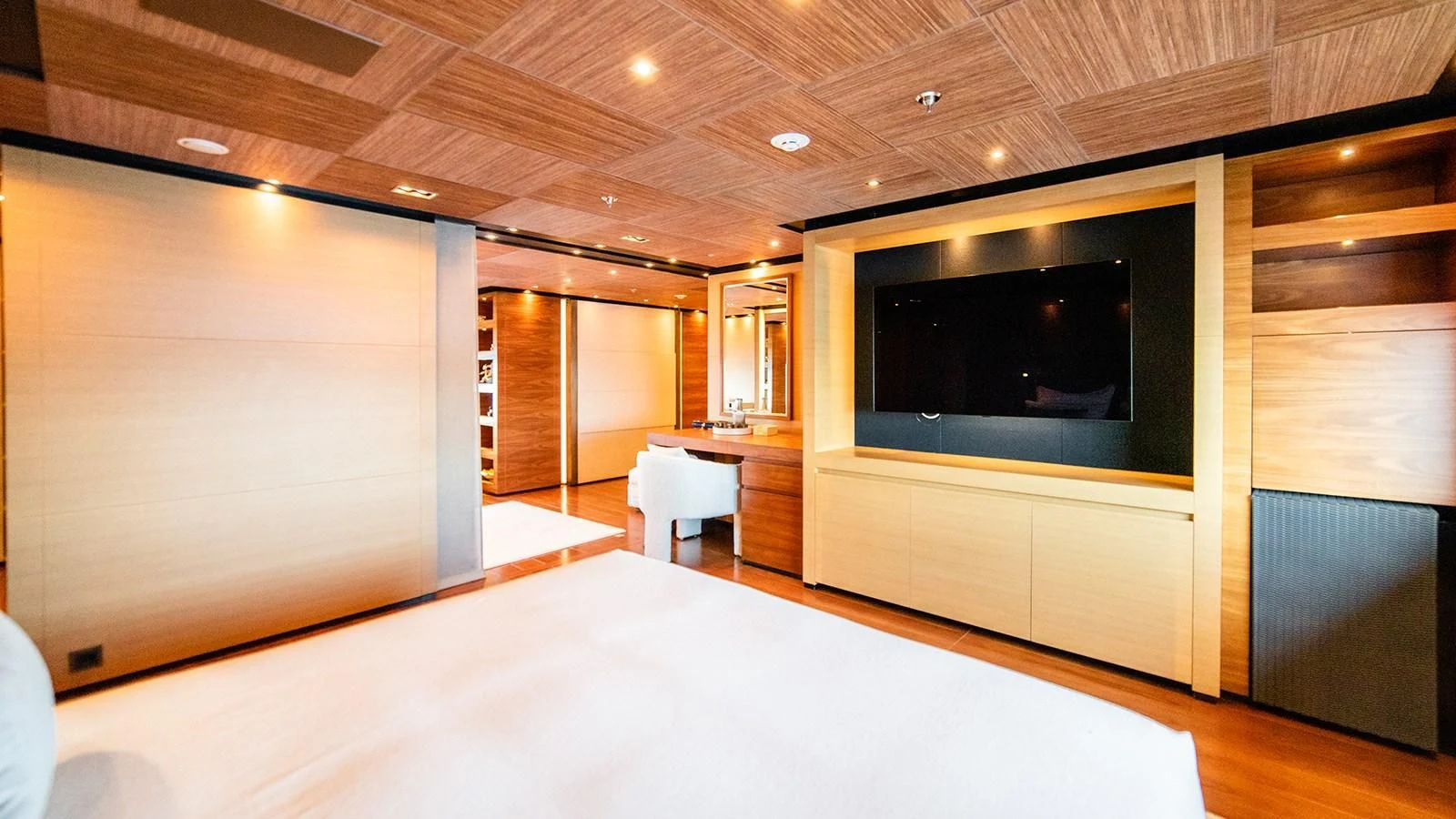 a room with a tv and a table aboard ALI BABA Yacht for Sale