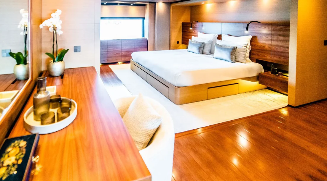 a room with a bed and a table aboard ALI BABA Yacht for Sale
