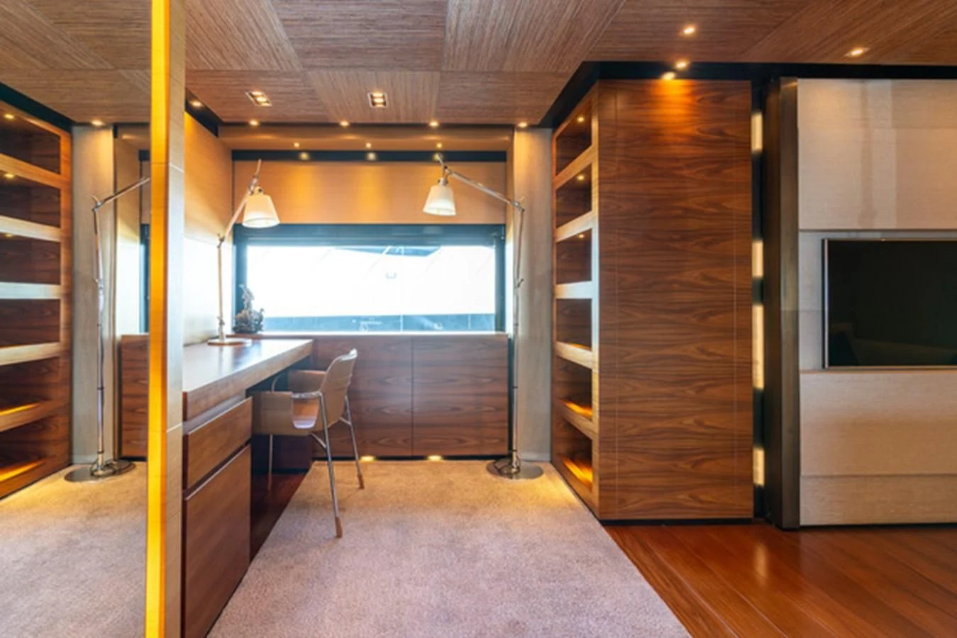 a room with a wood floor and a large window aboard ALI BABA Yacht for Sale