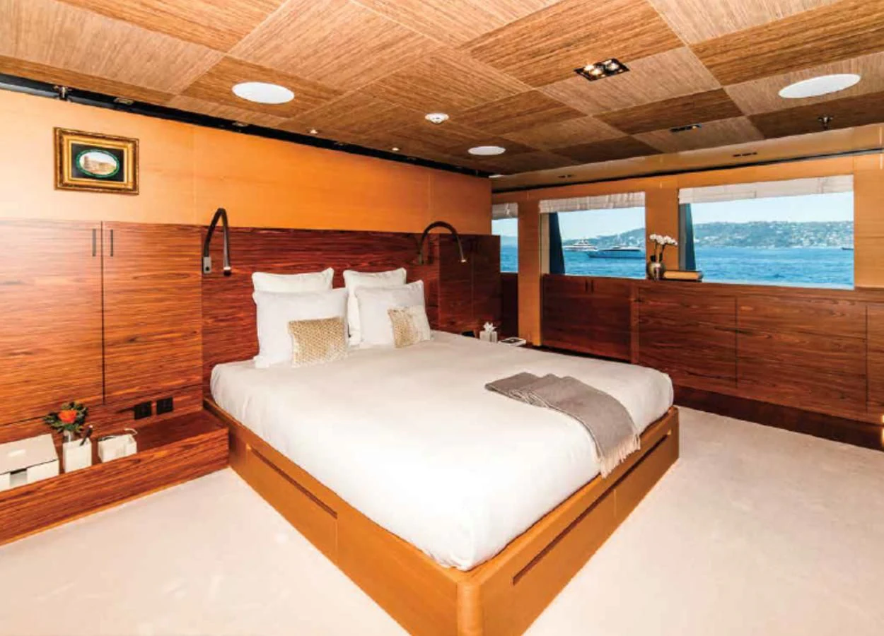 a room with a bed and a window aboard ALI BABA Yacht for Sale