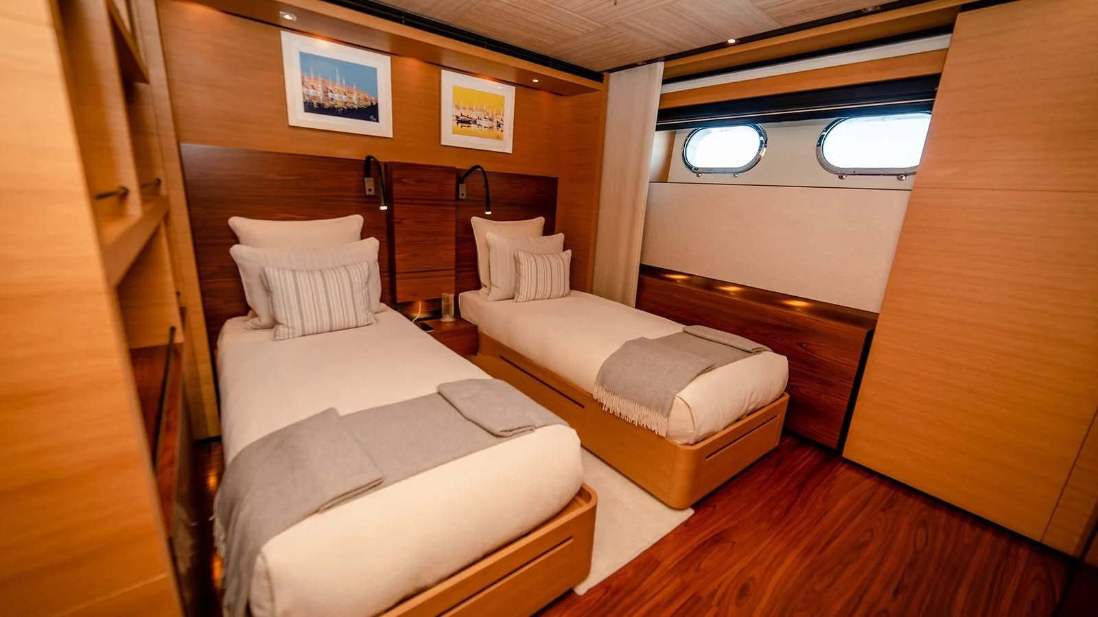 a room with a couple of beds aboard ALI BABA Yacht for Sale