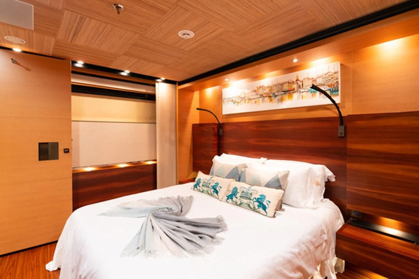 a bed with white sheets and pillows aboard ALI BABA Yacht for Sale