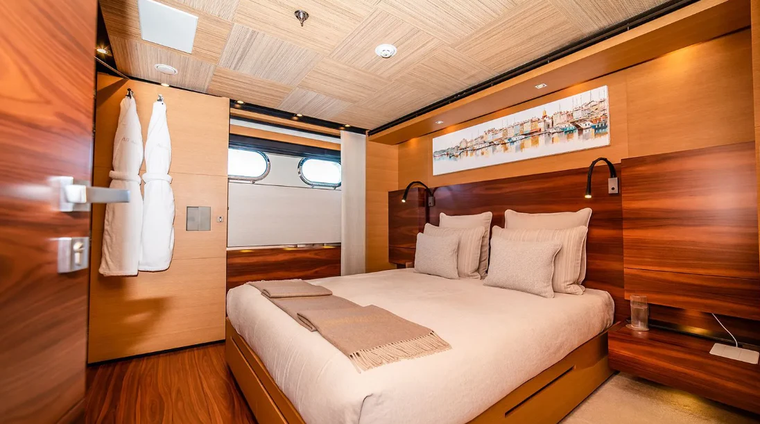 a room with a bed and a closet aboard ALI BABA Yacht for Sale