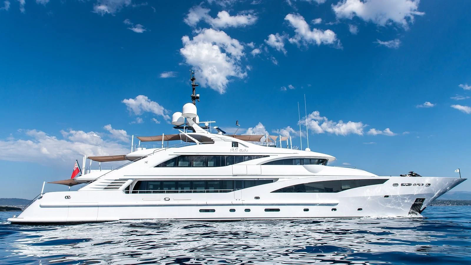 a white yacht in the water aboard ALI BABA Yacht for Sale