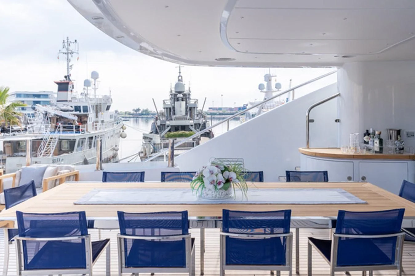 a large room with tables and chairs aboard ALI BABA Yacht for Sale