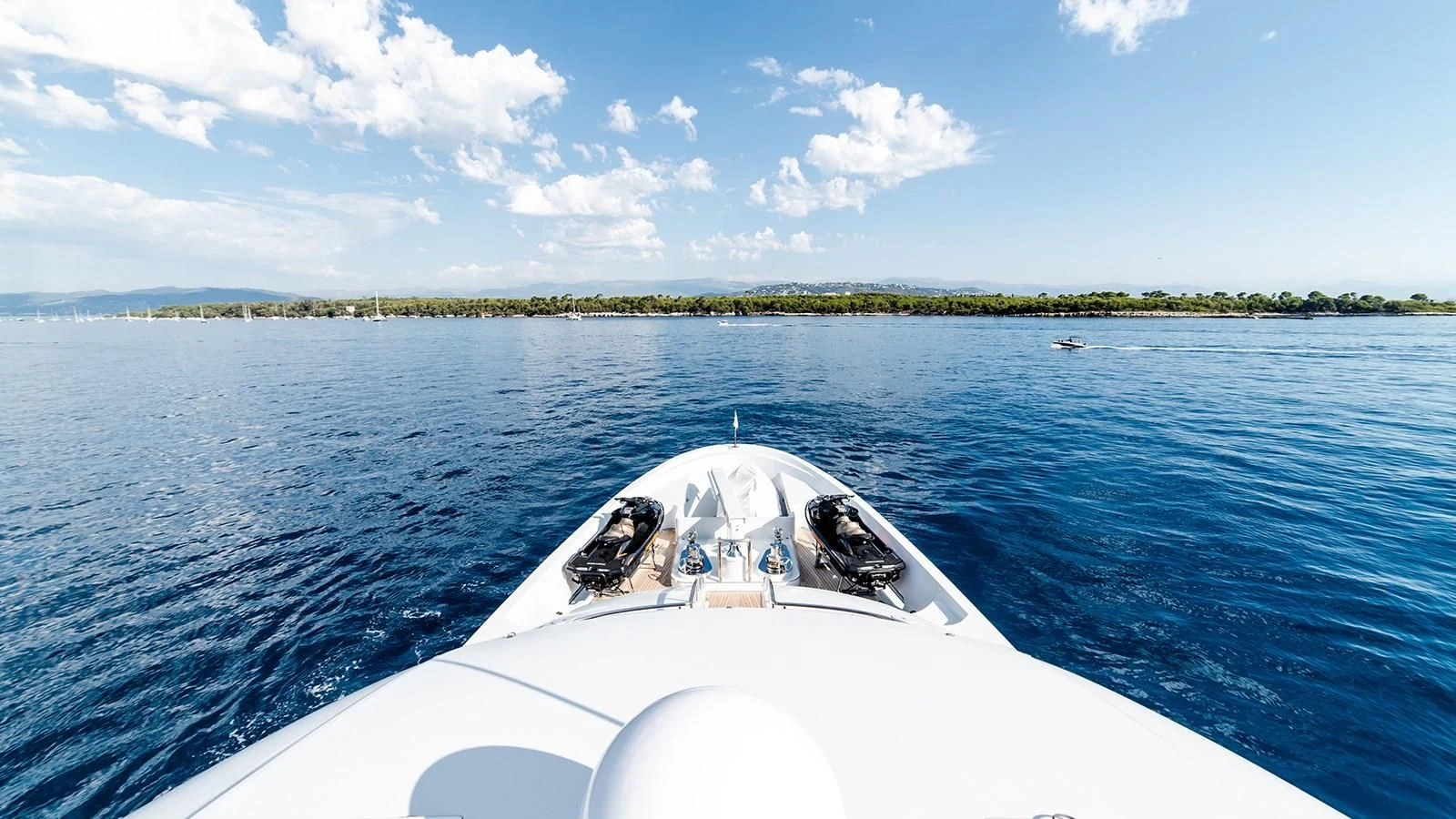 a white boat on the water aboard ALI BABA Yacht for Sale