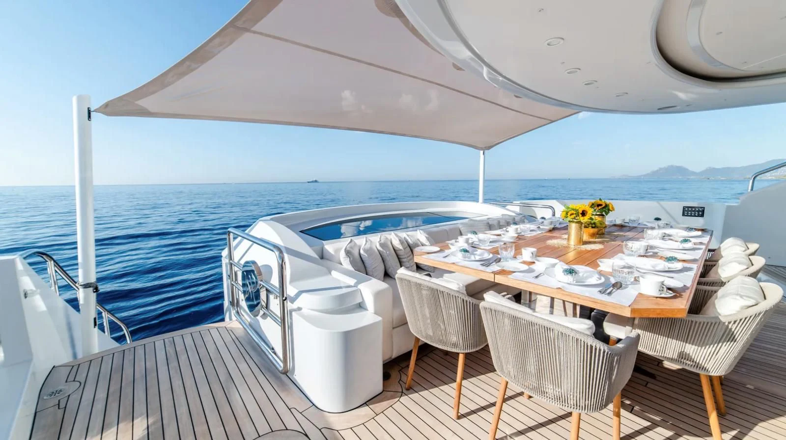 a table set for a meal on a boat aboard ALI BABA Yacht for Sale