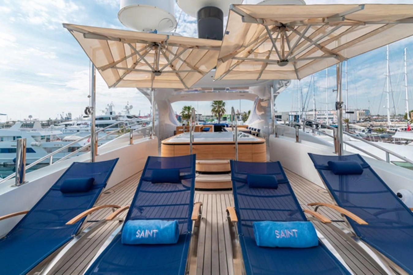 a deck with chairs on it aboard ALI BABA Yacht for Sale