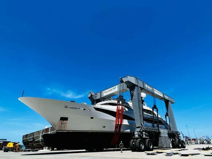 a large white boat on a trailer aboard ALI BABA Yacht for Sale