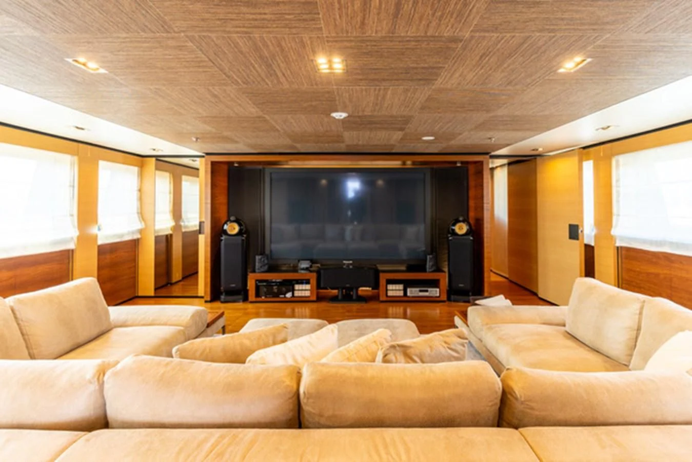 a living room with a large television aboard ALI BABA Yacht for Sale
