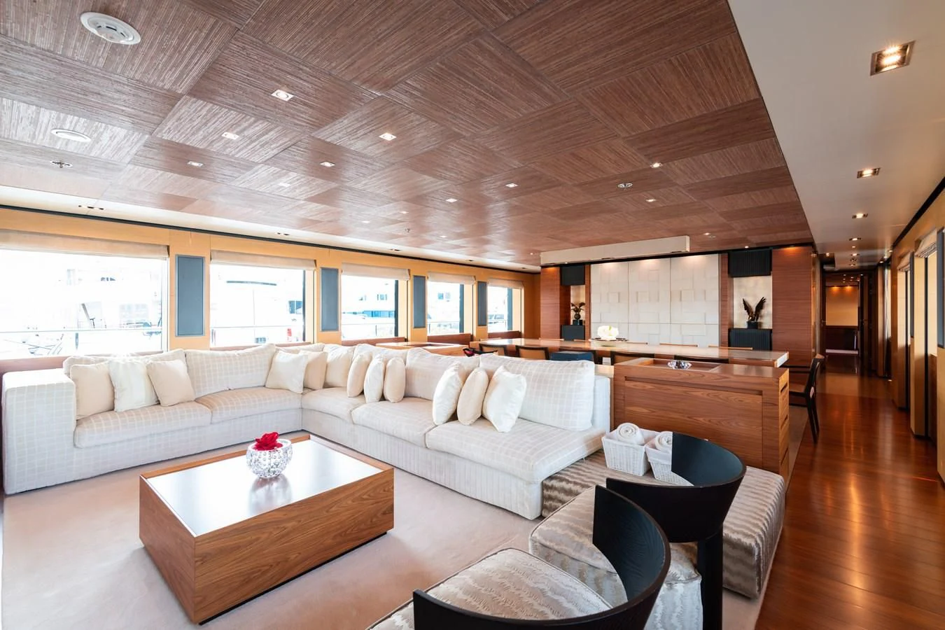 a living room with a large white sofa and a coffee table aboard ALI BABA Yacht for Sale