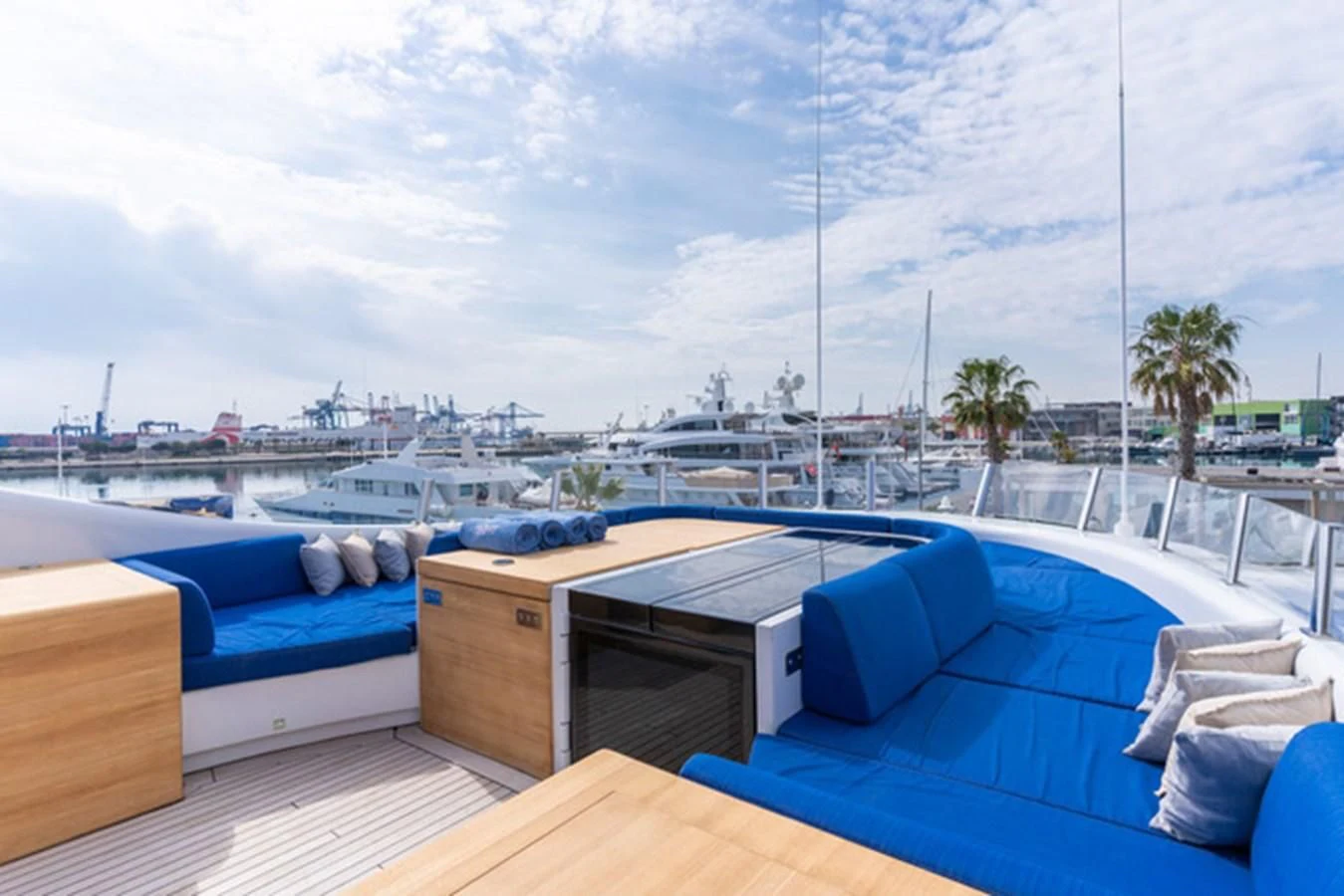 a deck with a pool and a view of the city aboard ALI BABA Yacht for Sale