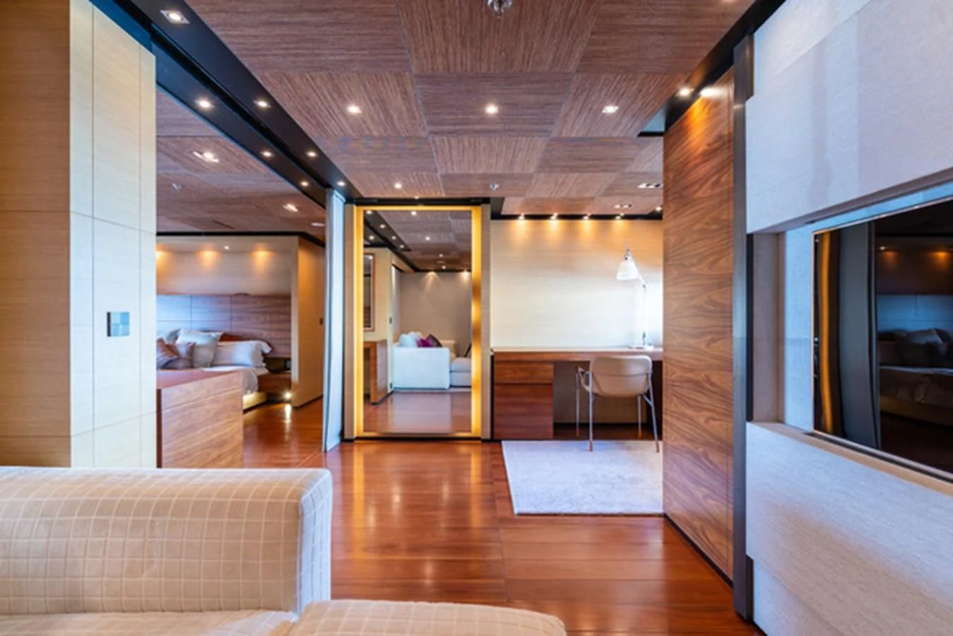 a living room with wood floors aboard ALI BABA Yacht for Sale