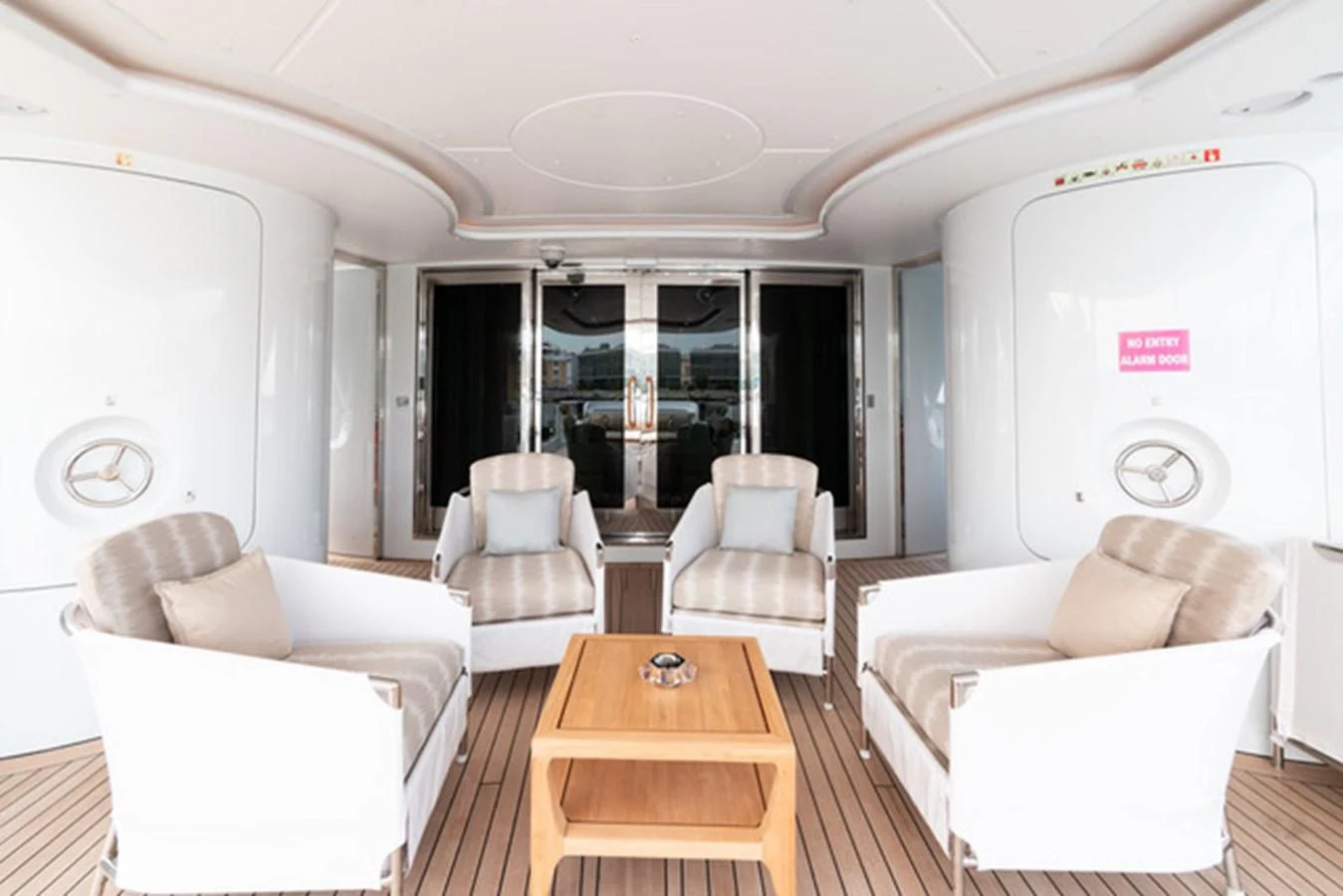 a living room with a table and chairs aboard ALI BABA Yacht for Sale