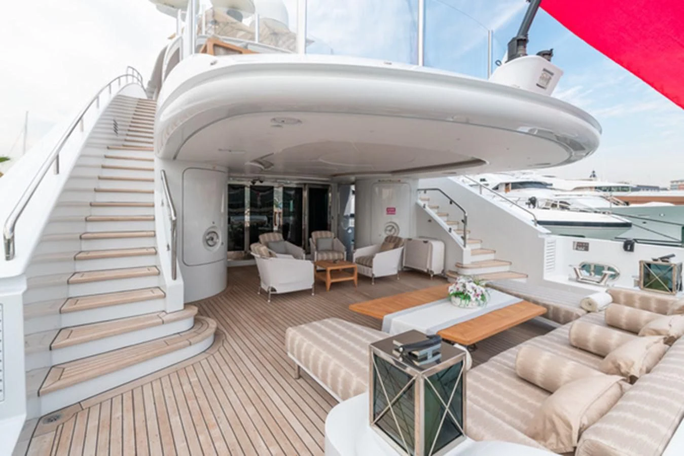 a large white boat on a deck aboard ALI BABA Yacht for Sale