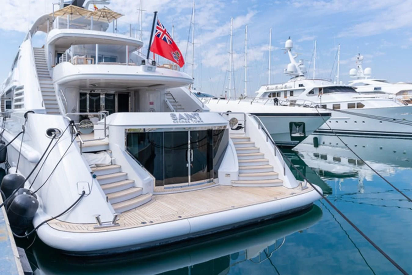 a boat with a flag on the front aboard ALI BABA Yacht for Sale