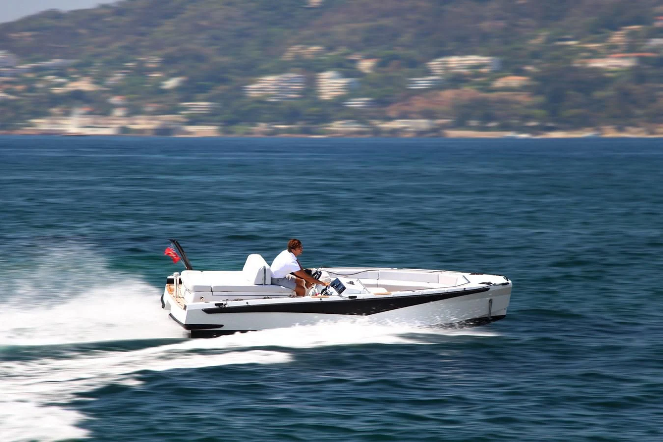 a man driving a boat aboard ALI BABA Yacht for Sale