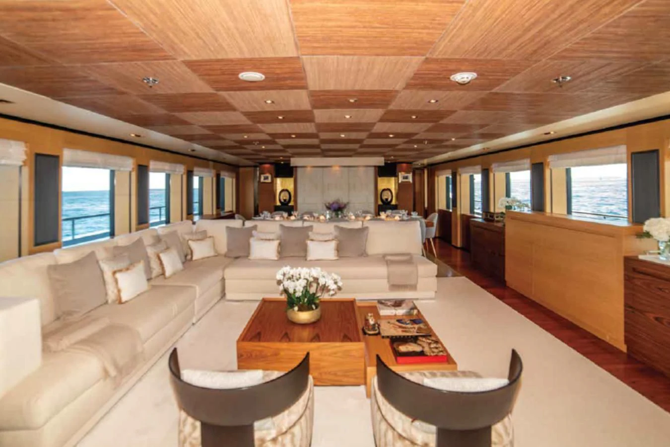 a living room with a couch and a coffee table aboard ALI BABA Yacht for Sale